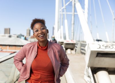 Black woman smiling on Nelson Mandela bridge