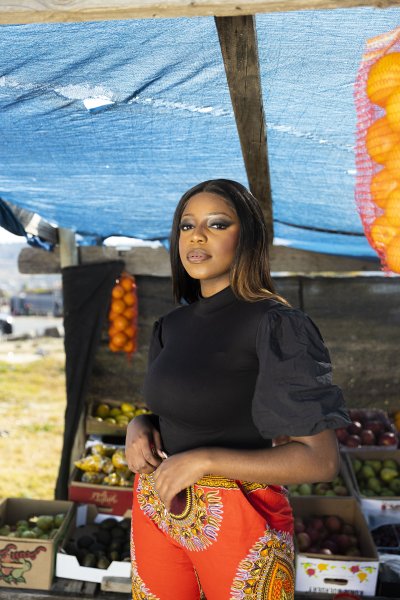 Black woman at the market posing