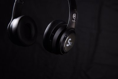 Headphones on a black backdrop