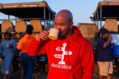 Black man drinking coffee from a mug