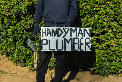 Handyman and plumber sign.