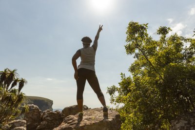Black woman climbing rocks in Mpumalanga