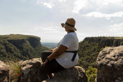 Black woman watching the views of Mpumalanga