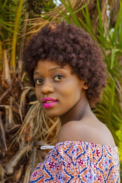Young afro woman with brown hair