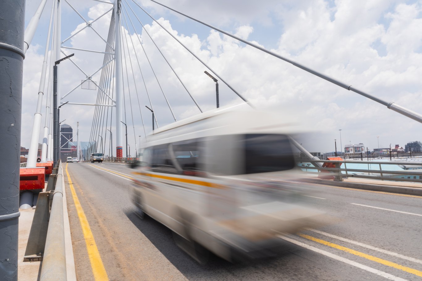 Taxi passing Nelson Mandela bridge fast