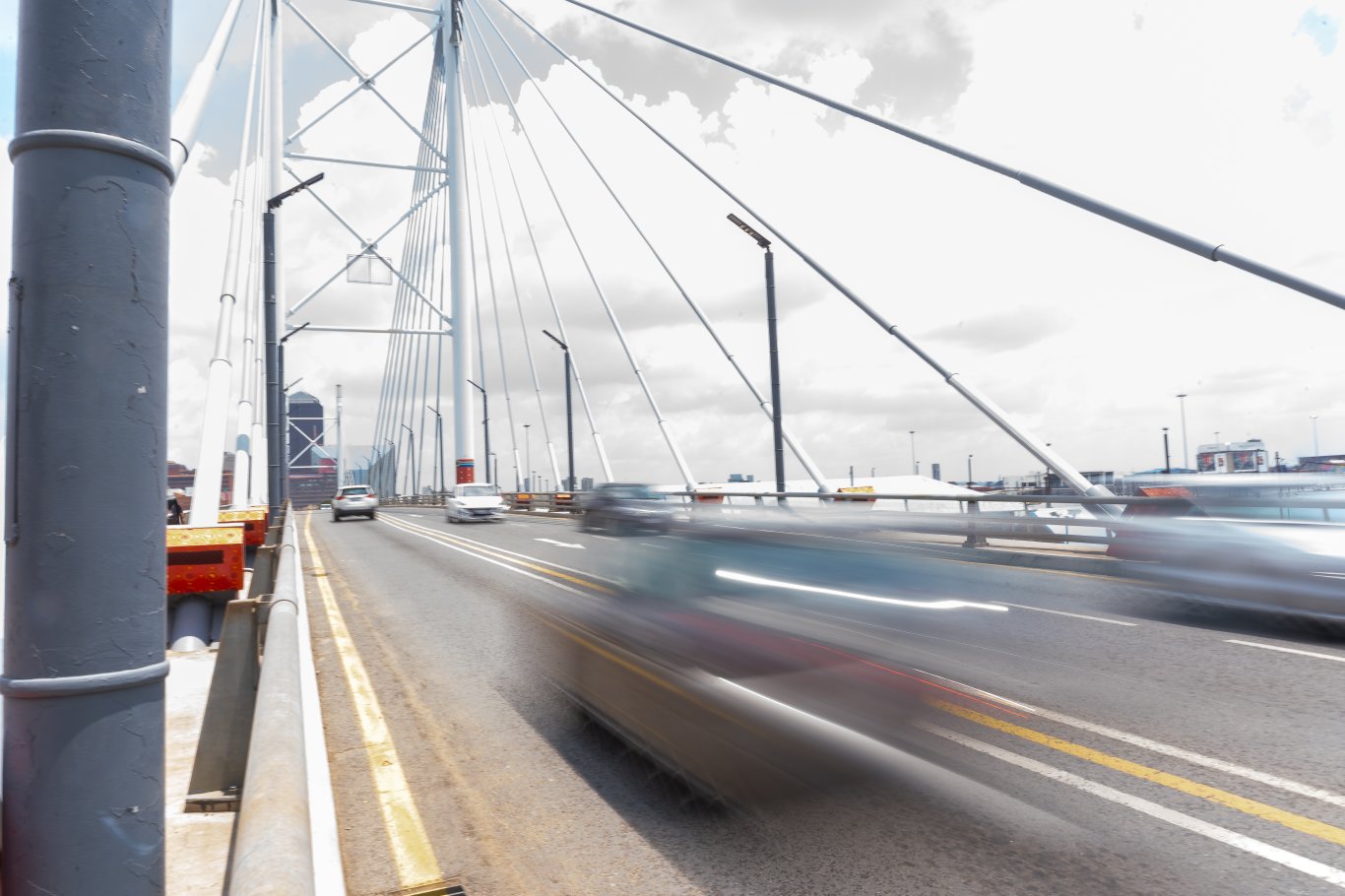 Blurry car passing by on Nelson Mandela bridge.