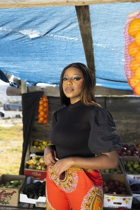 Black woman at the market posing