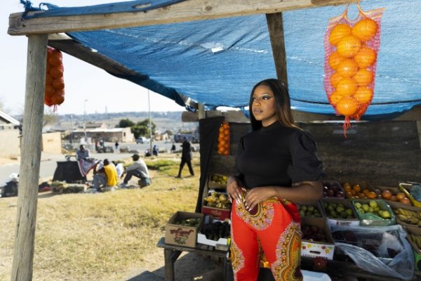 Black woman at the fruit store in Alex