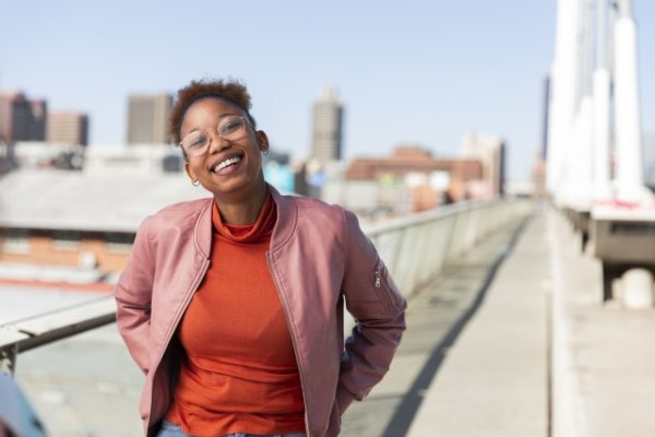 Black woman on Nelson Mandela bridge smiling