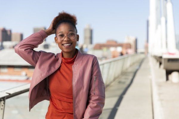 Black woman on Nelson Mandela bridge smiling