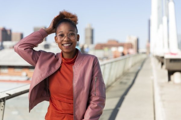 Black woman on Nelson Mandela bridge smiling
