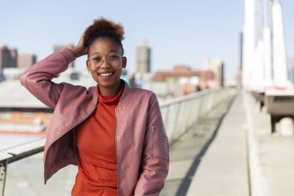 Black woman on Nelson Mandela bridge smiling