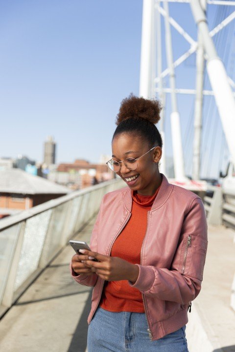 Black woman on Nelson Mandela bridge on cellphone