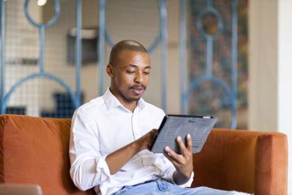 Black man working on ipad