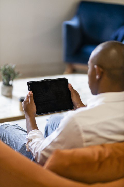 Black man looking at ipad