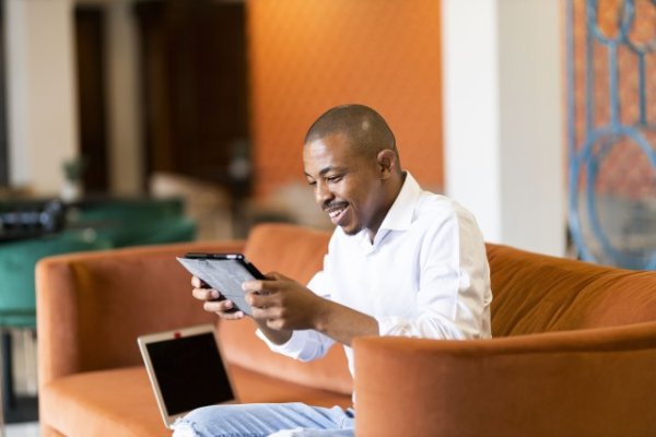 Black man working on ipad