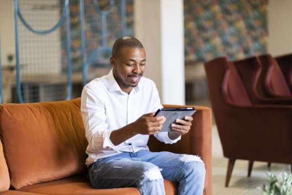 Black man working on ipad