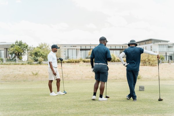 Black male golfers discussing the next hole