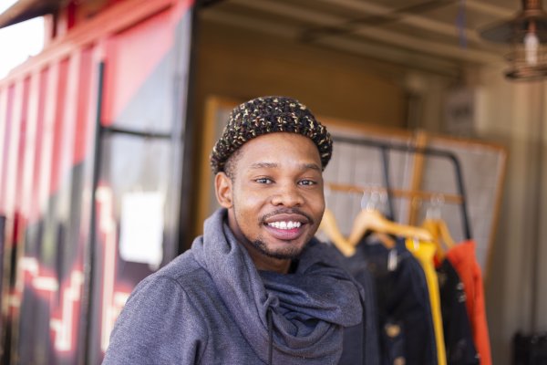 Black man smiling with beanie