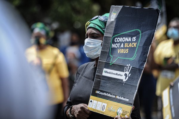Black woman protest against racism | Corona is not a black virus