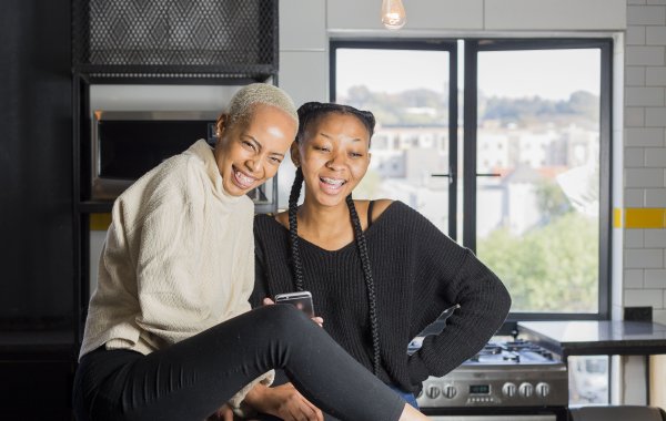 Black woman students laughing