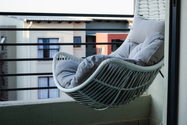 Hanging chair in a town house balcony