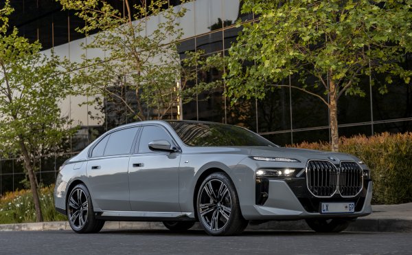 BMW i740i car parked near a building