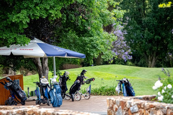 Golf bags outside the clubhouse at a golf tournament