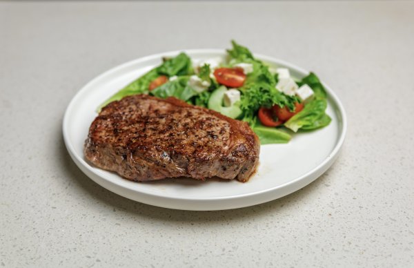 Juicy steak with a salad on a plate