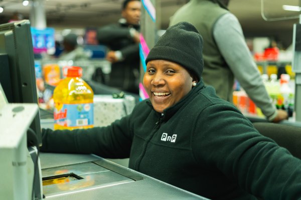 Pick n Pay employee at a teller.