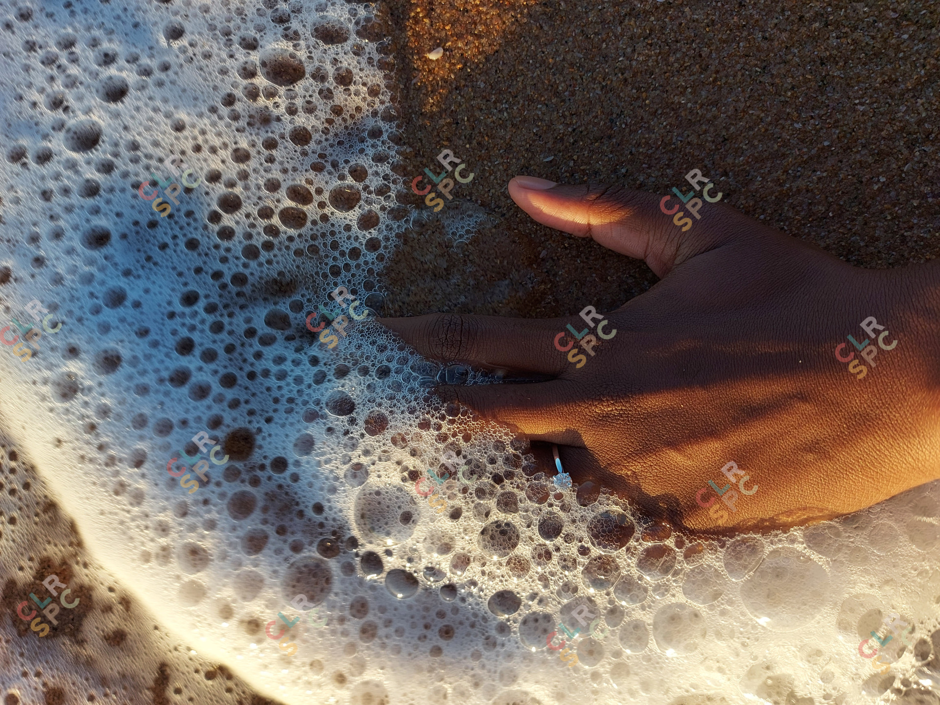Engagement ring by the beach