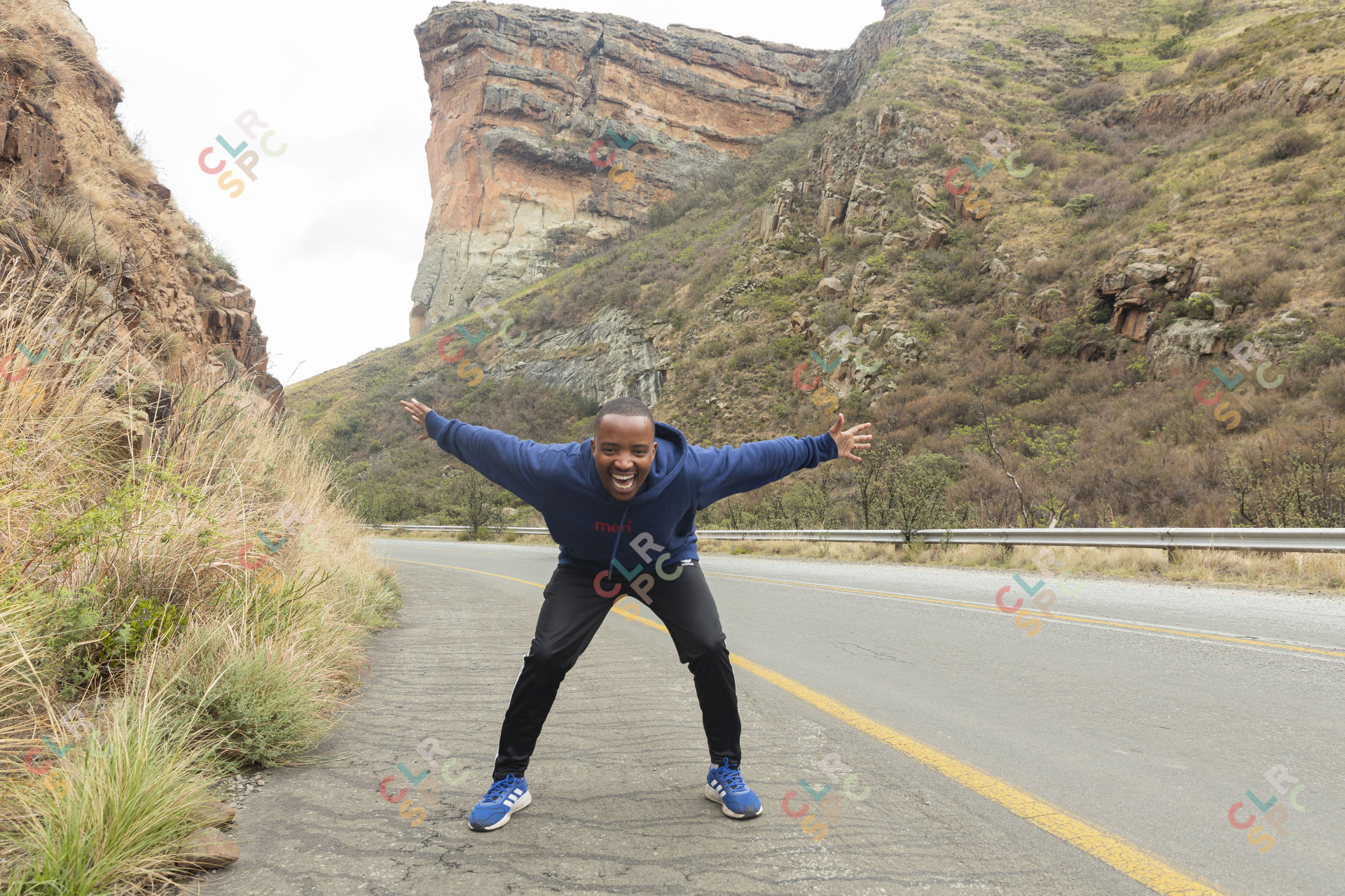 Black man standing in the mountains