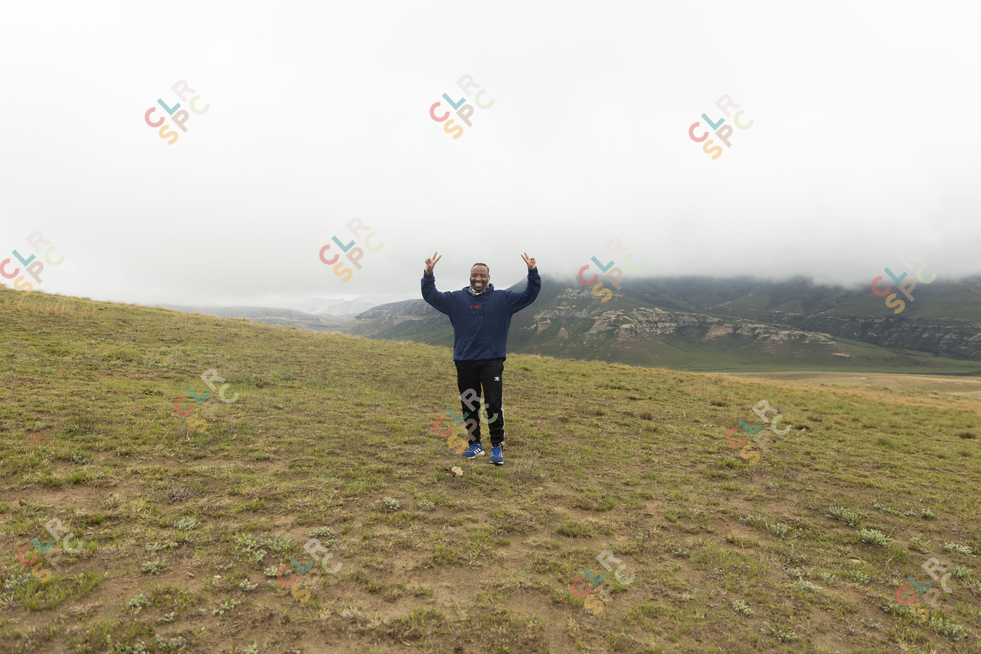 Black man standing in the mountains