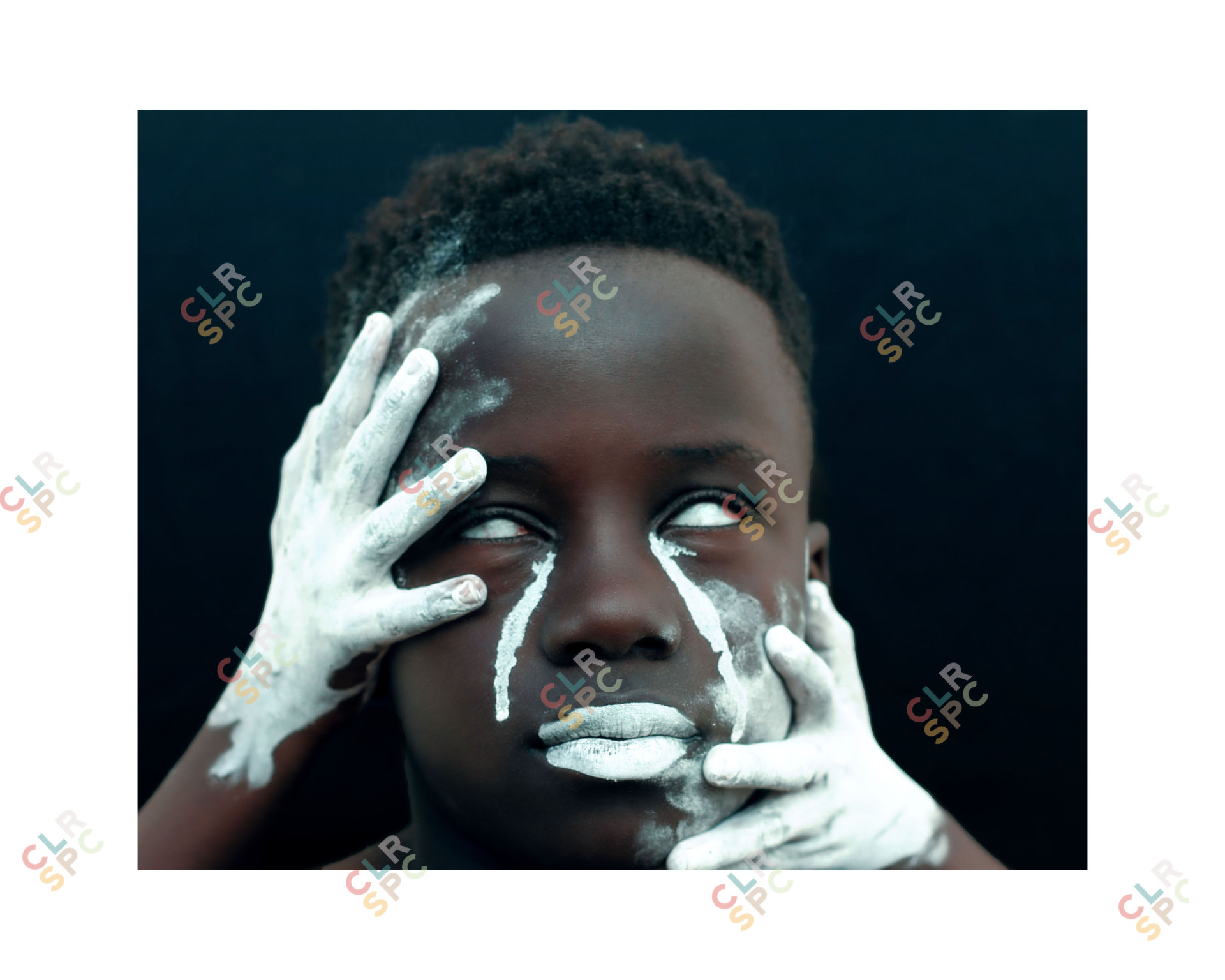 Young black man covered in white ash