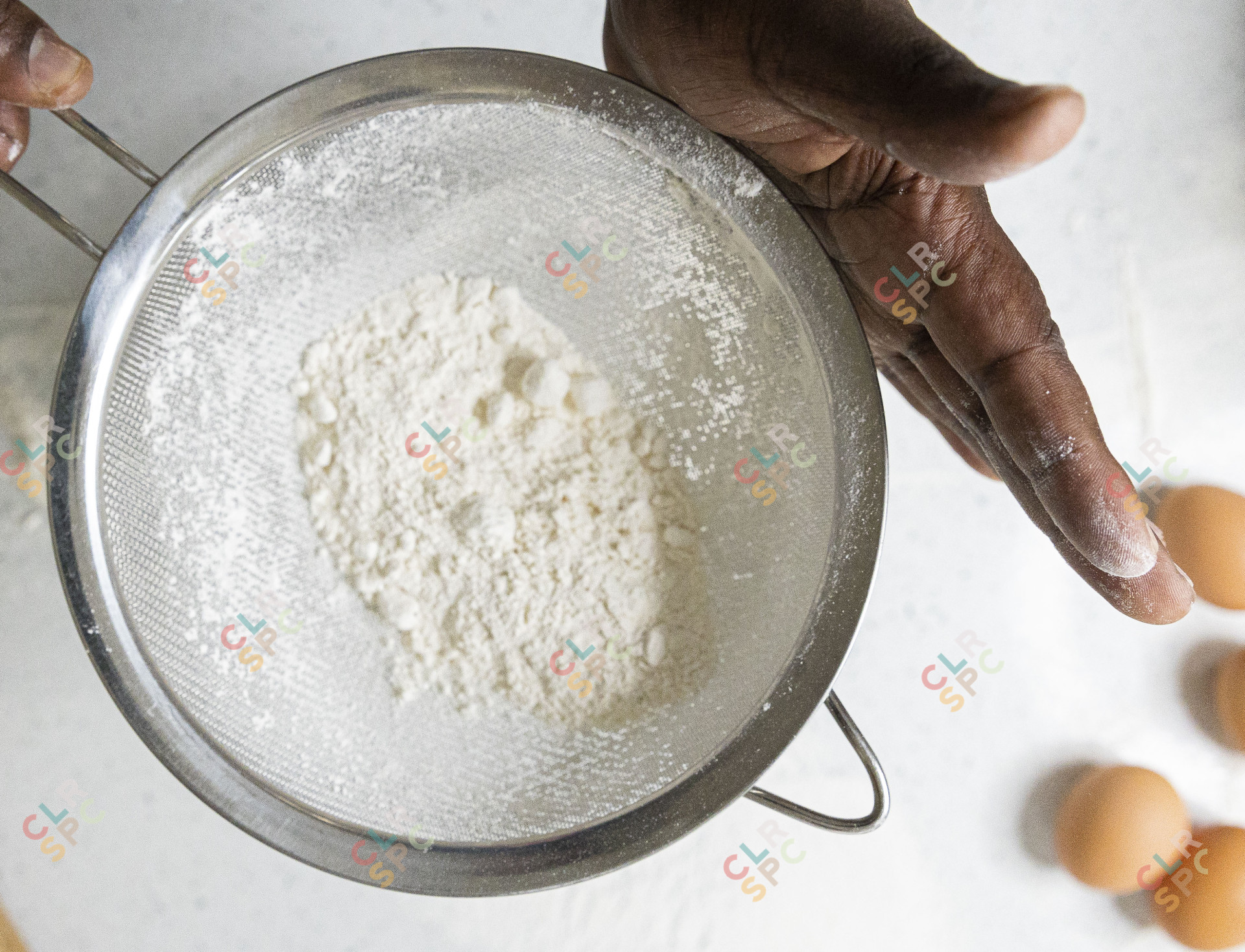 Holding a sift with flour