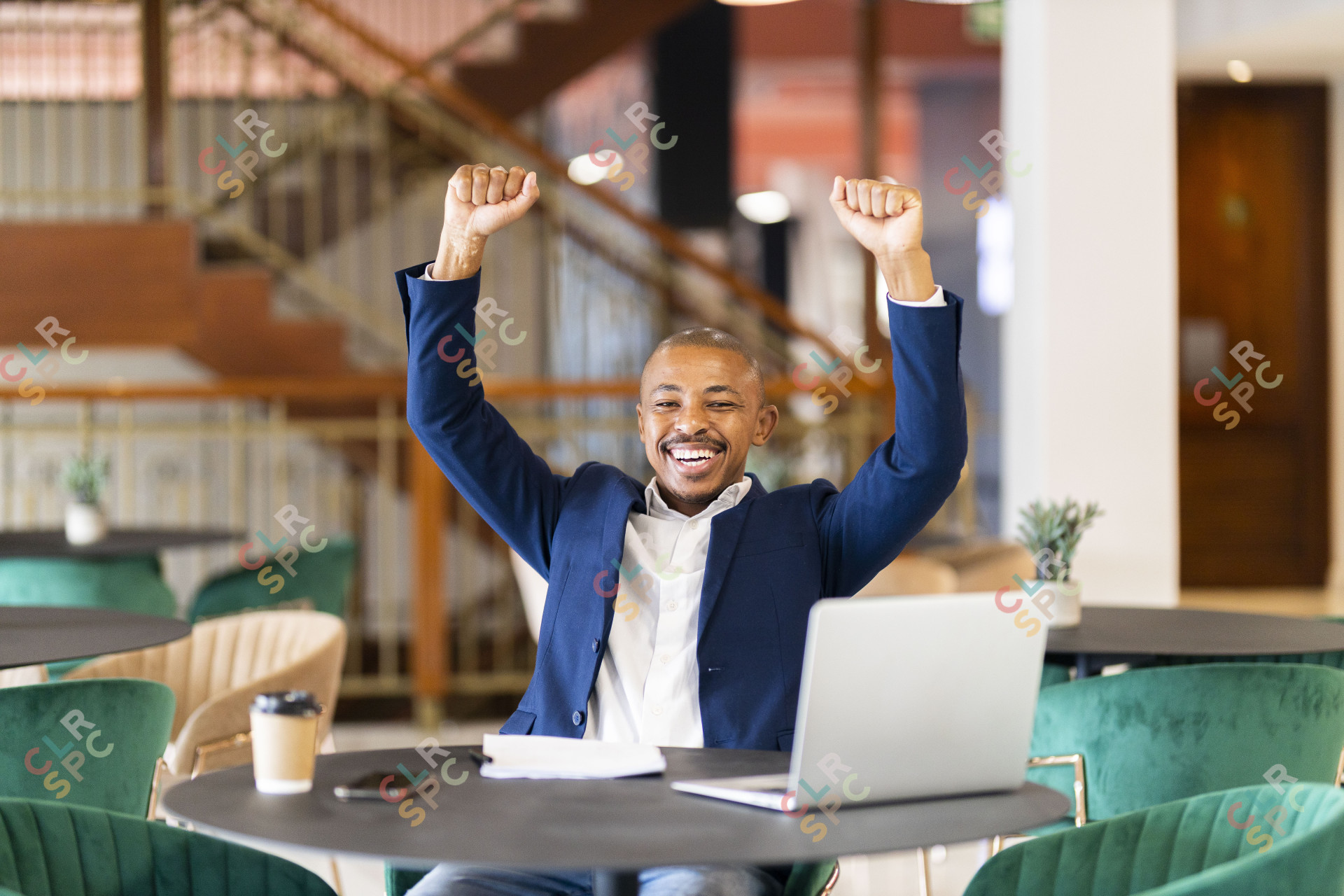 Black business man at work celebrating