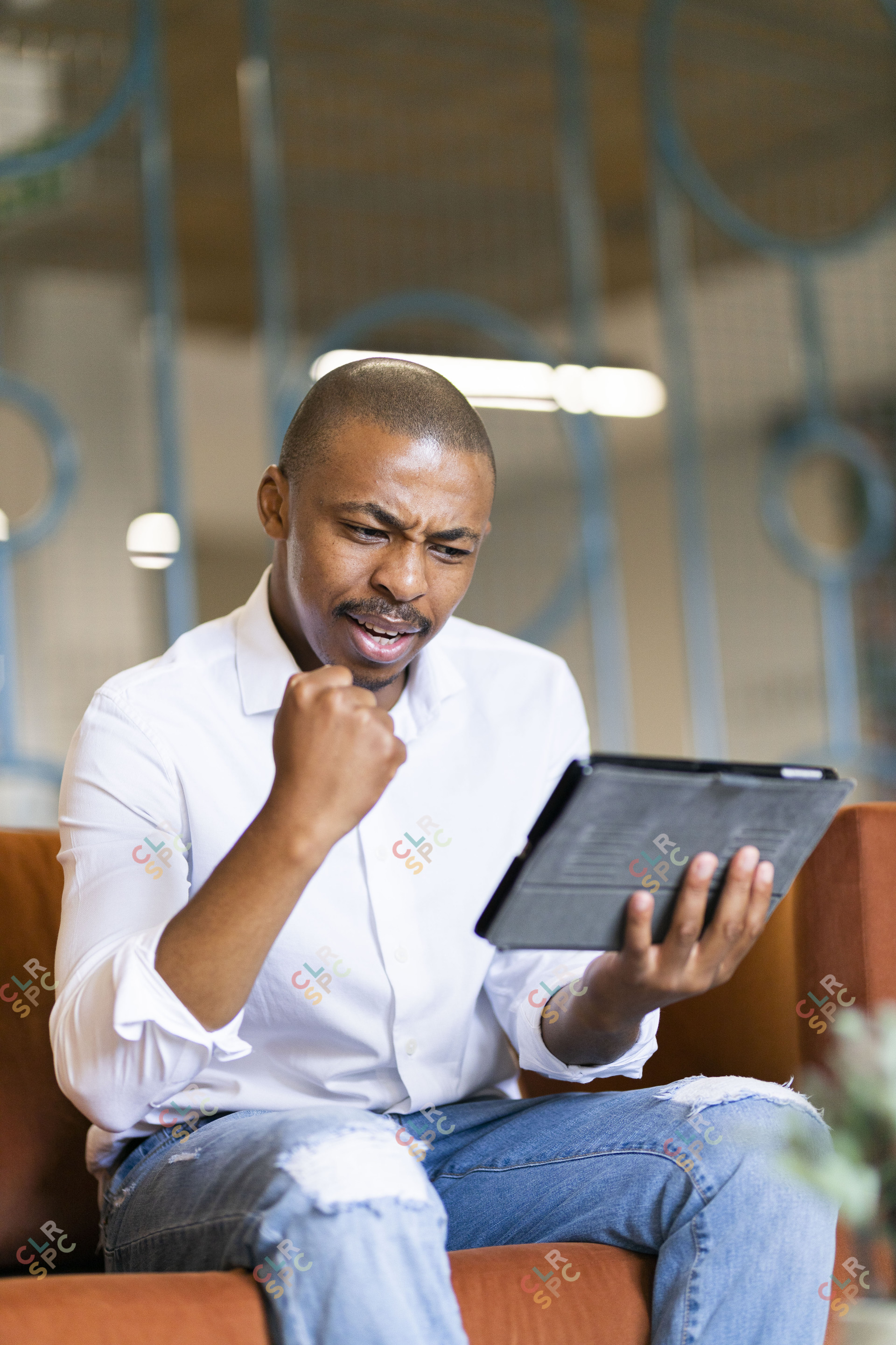 Black man looking at ipad