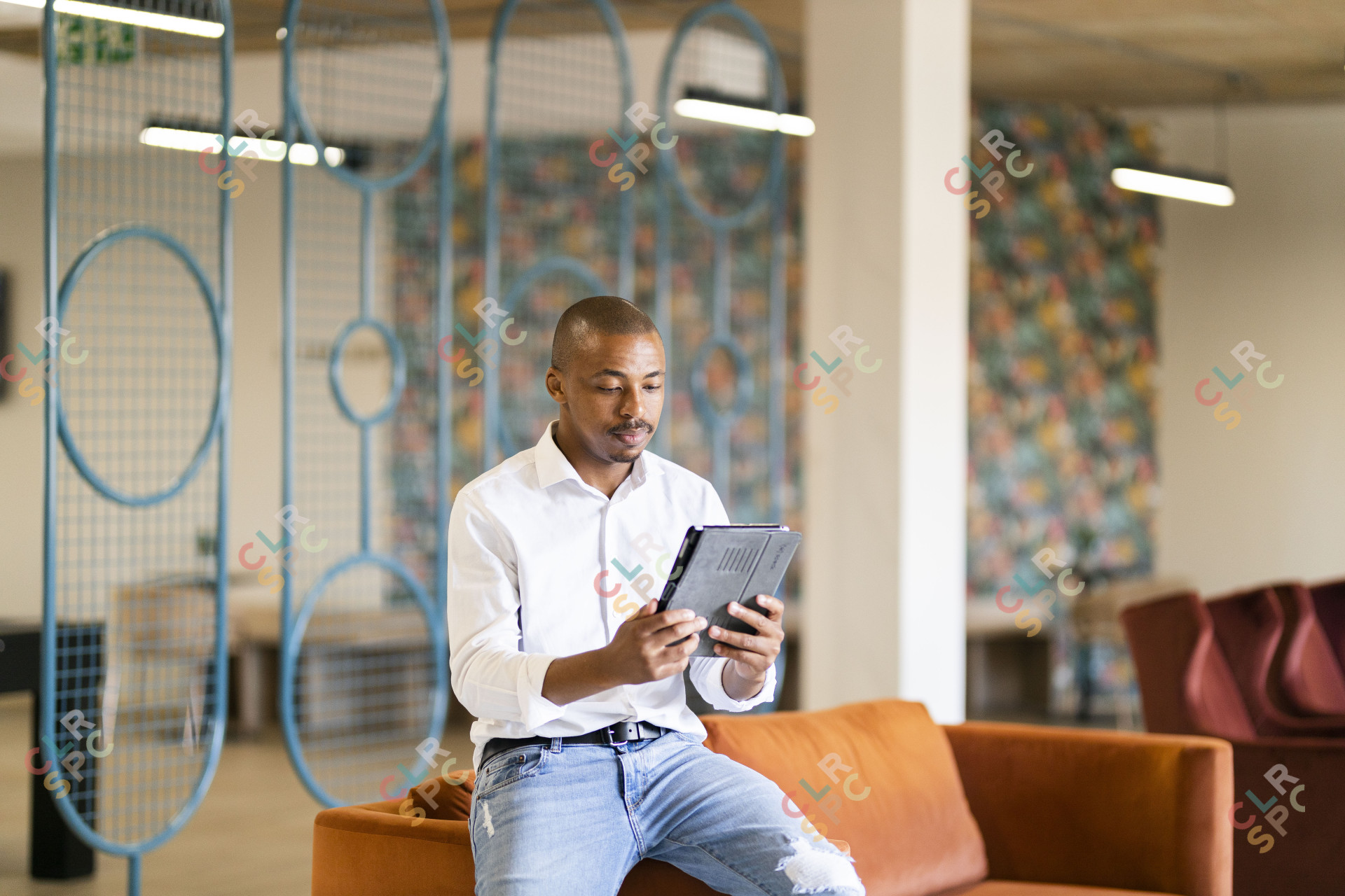 Black man looking at ipad