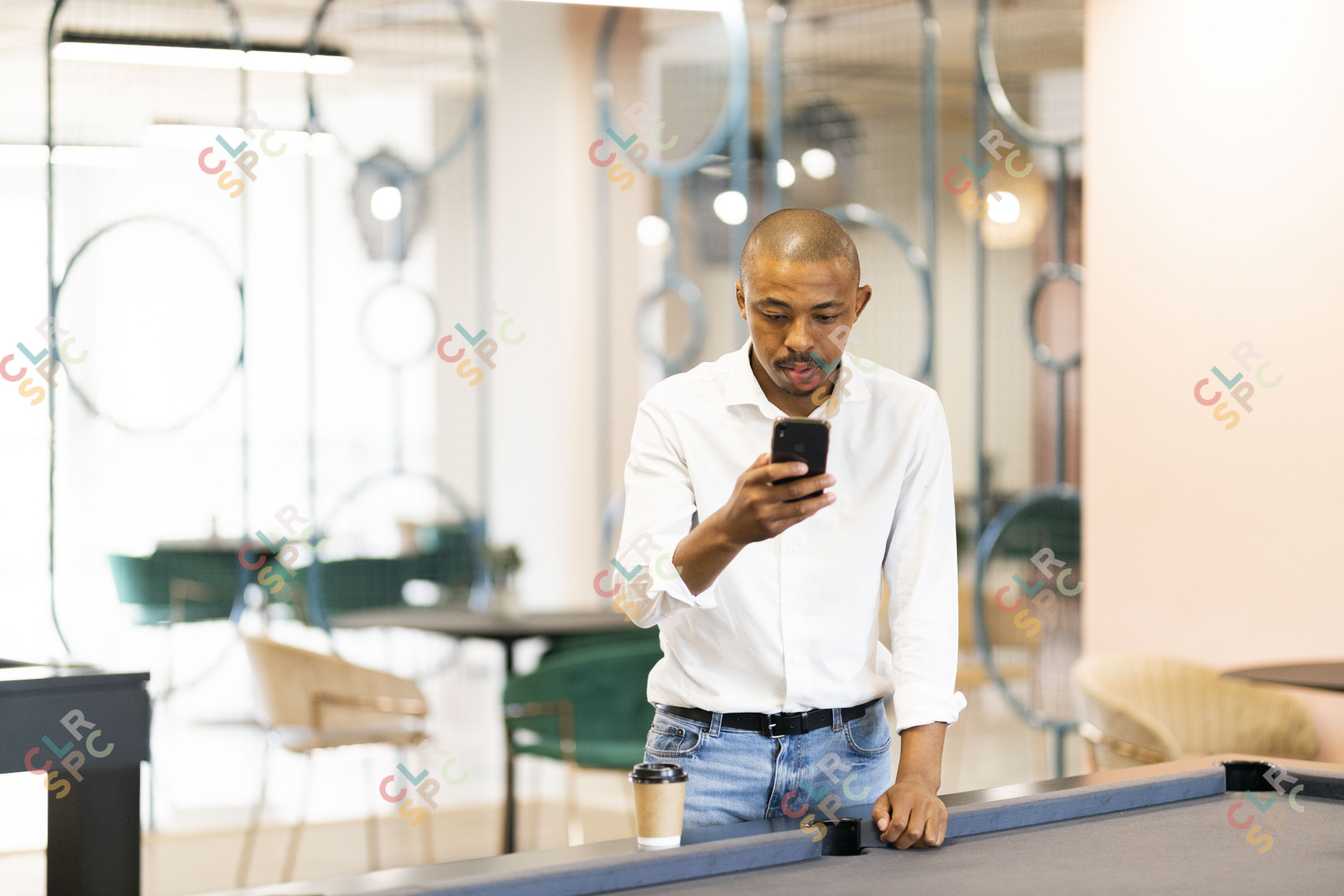 Black business man looking at smartphone