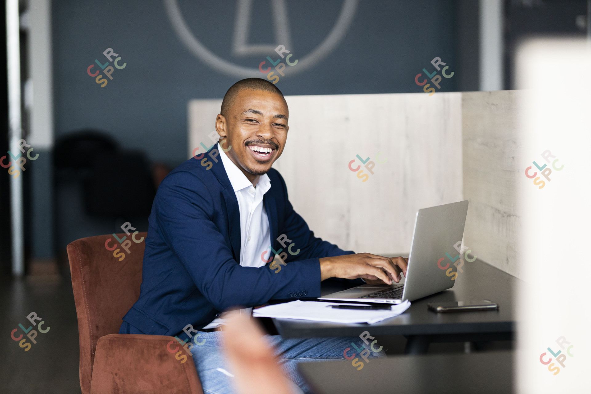 Black business man working from his desk at the office