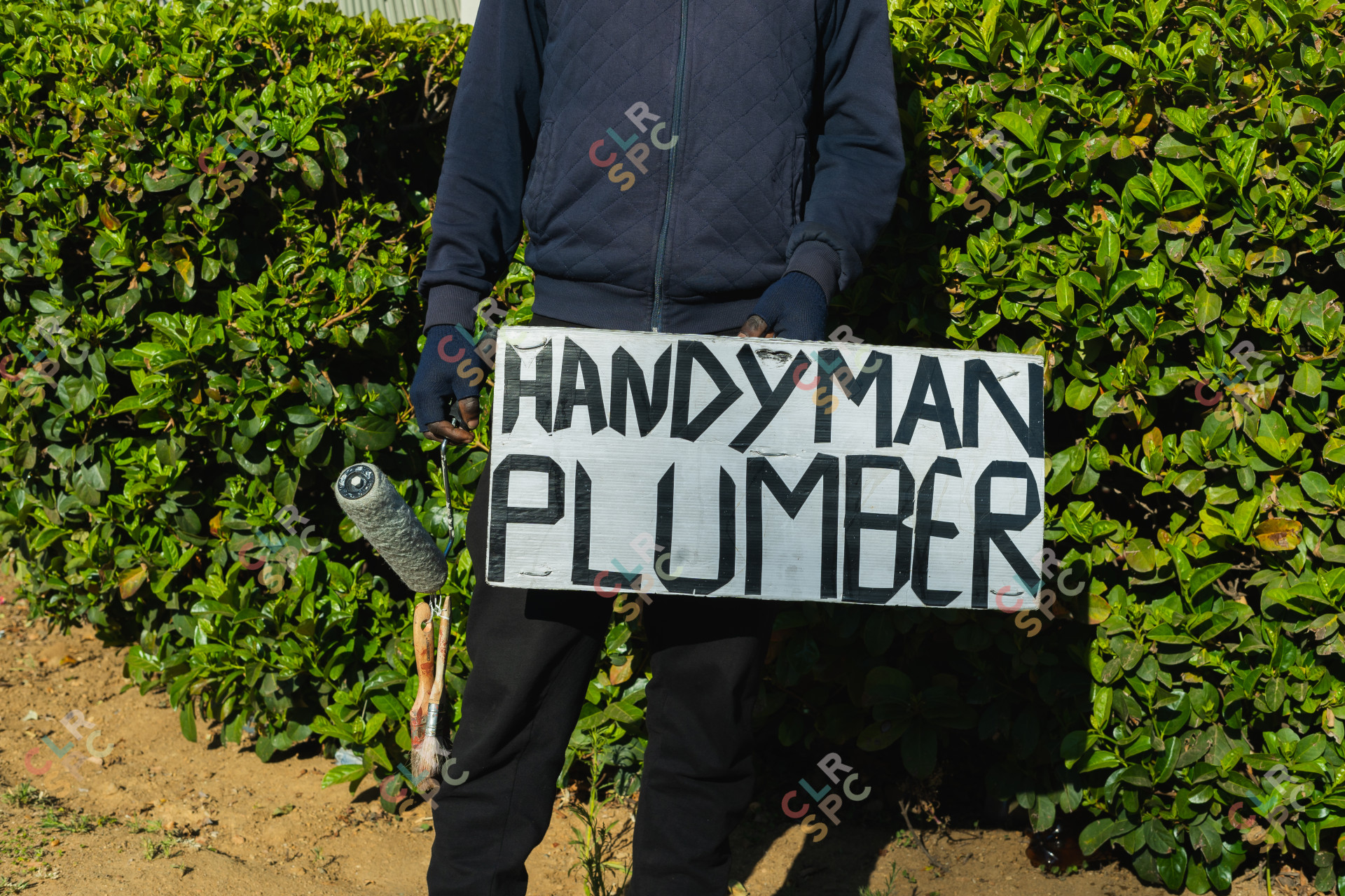 Handyman and plumber sign with a paint brush.