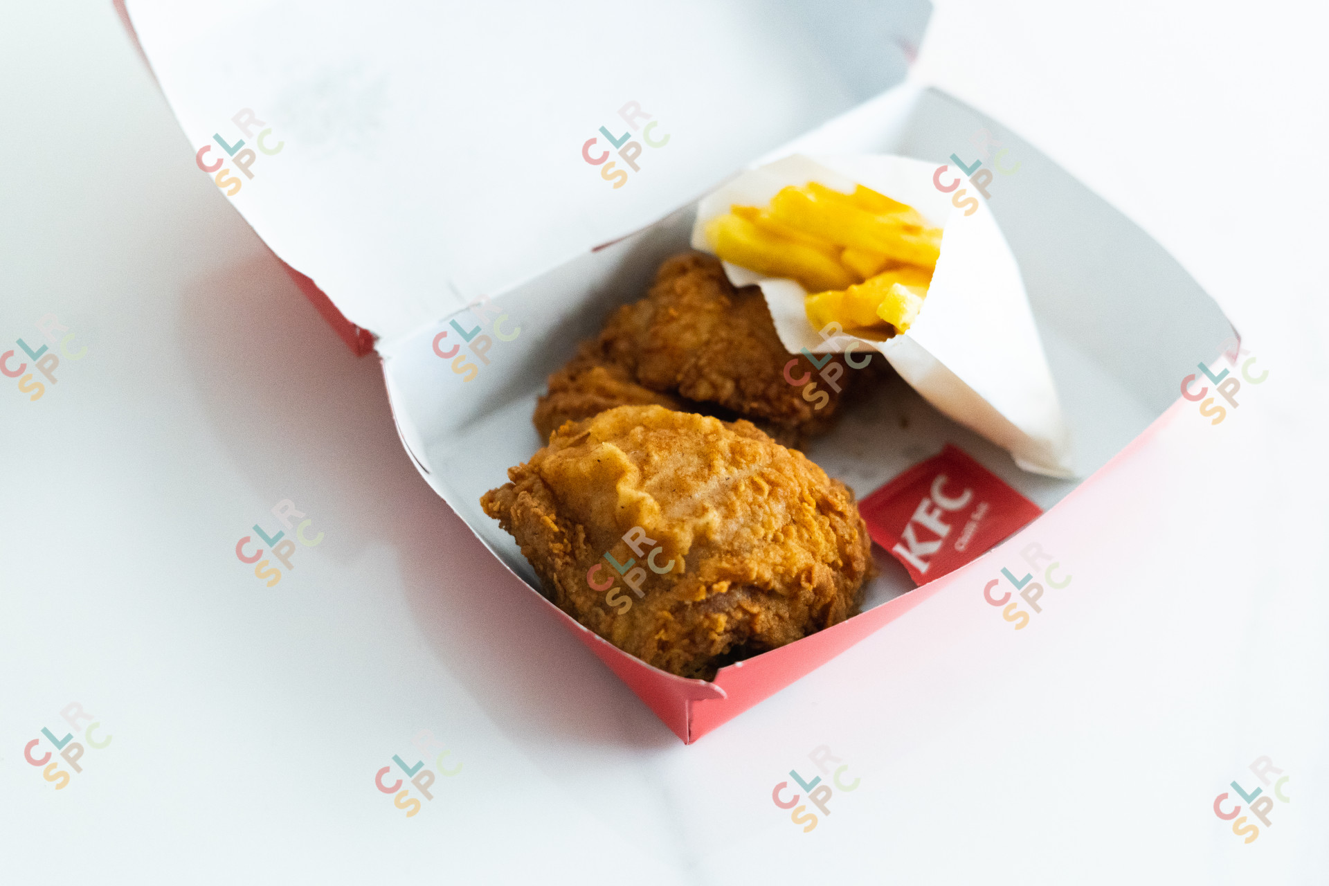 KFC chicken with chips meal.