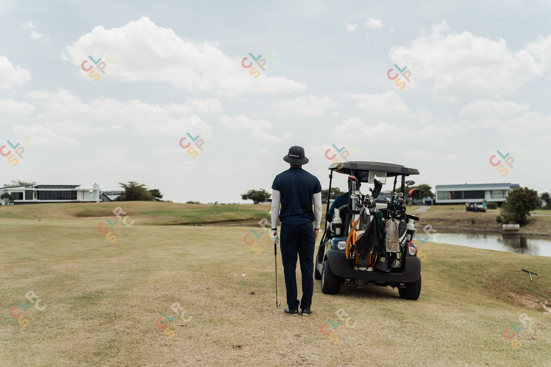 Black male golfer looking at the green to take the perfect shot