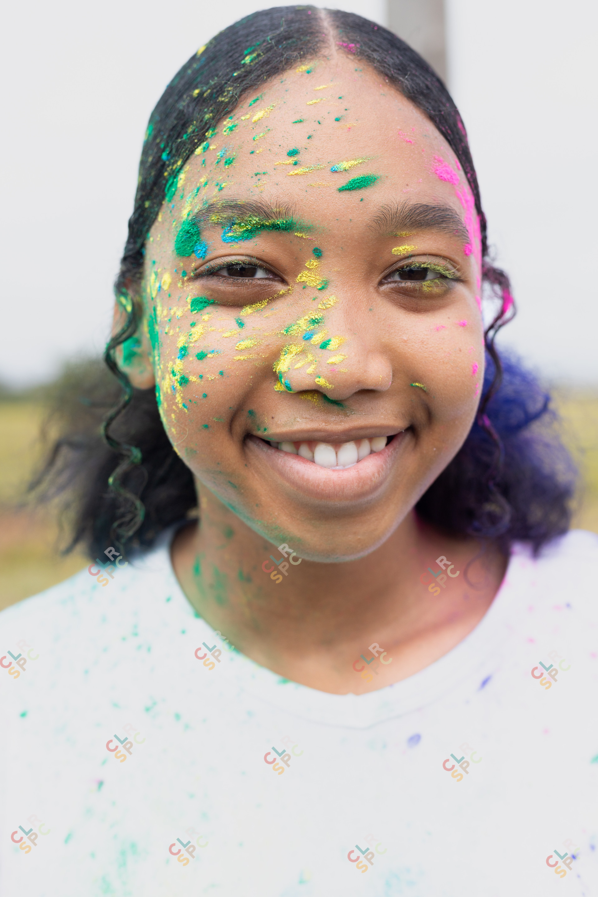 black woman having fun at Colour Fun Run
