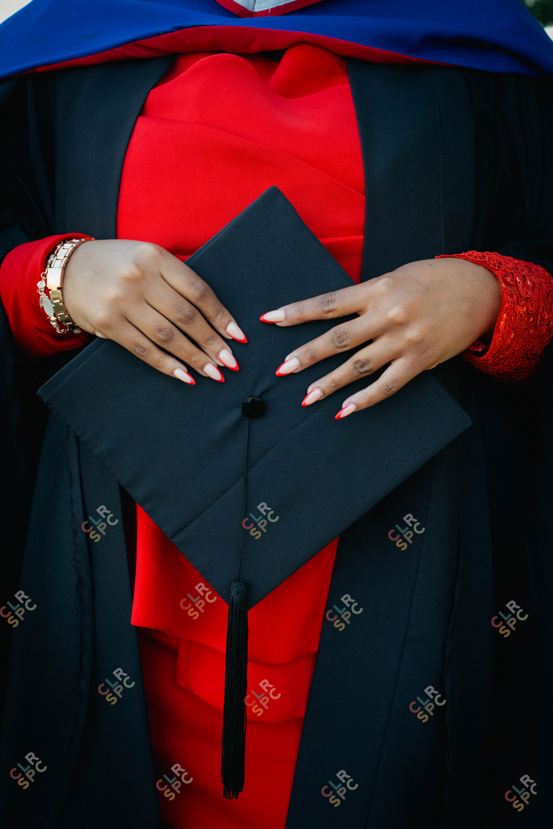 Black woman hands holding graduation hat