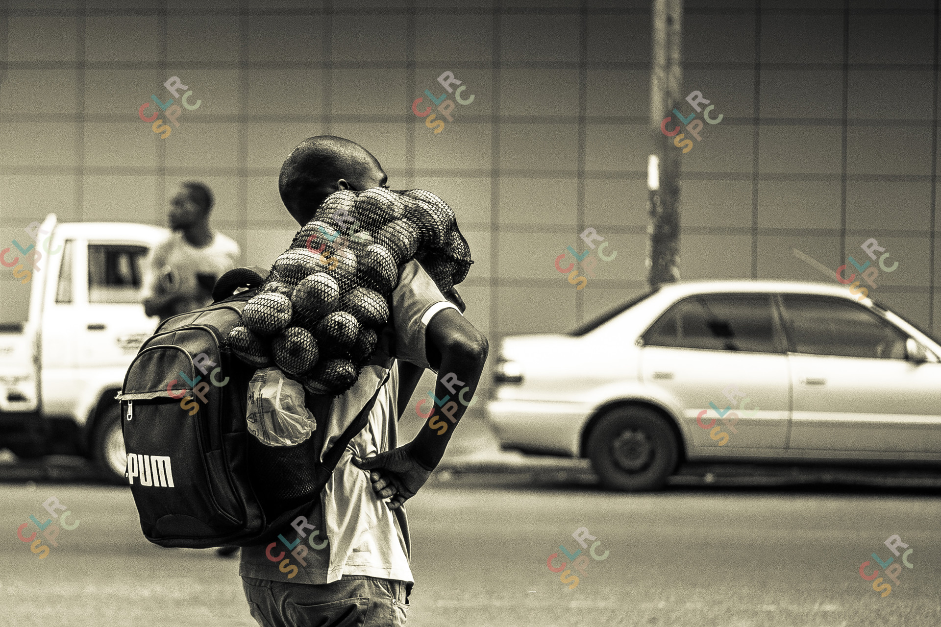 Man carrying a sack of potatoes