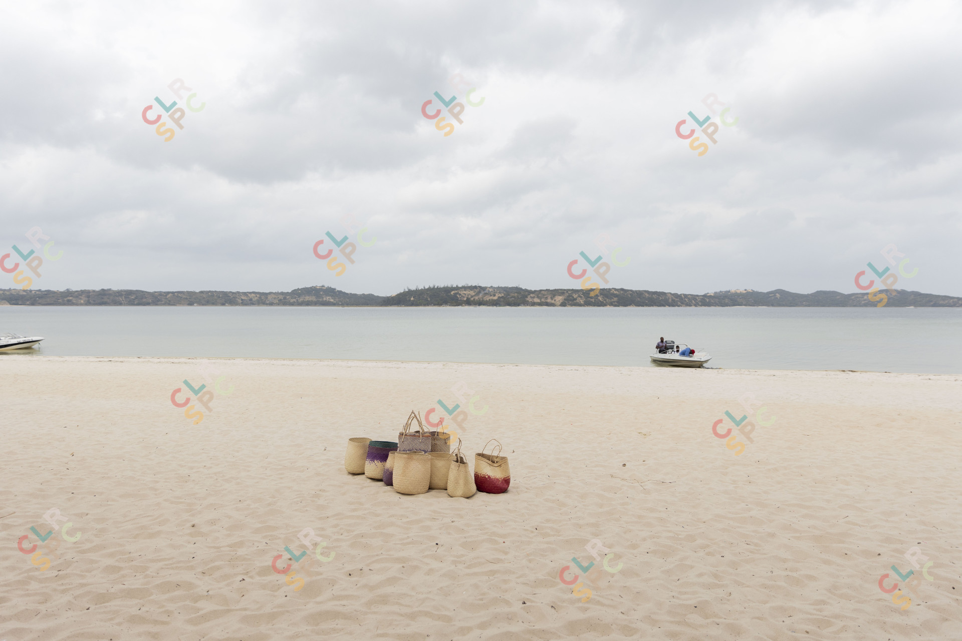 Group of baskets on sand near a lagoon