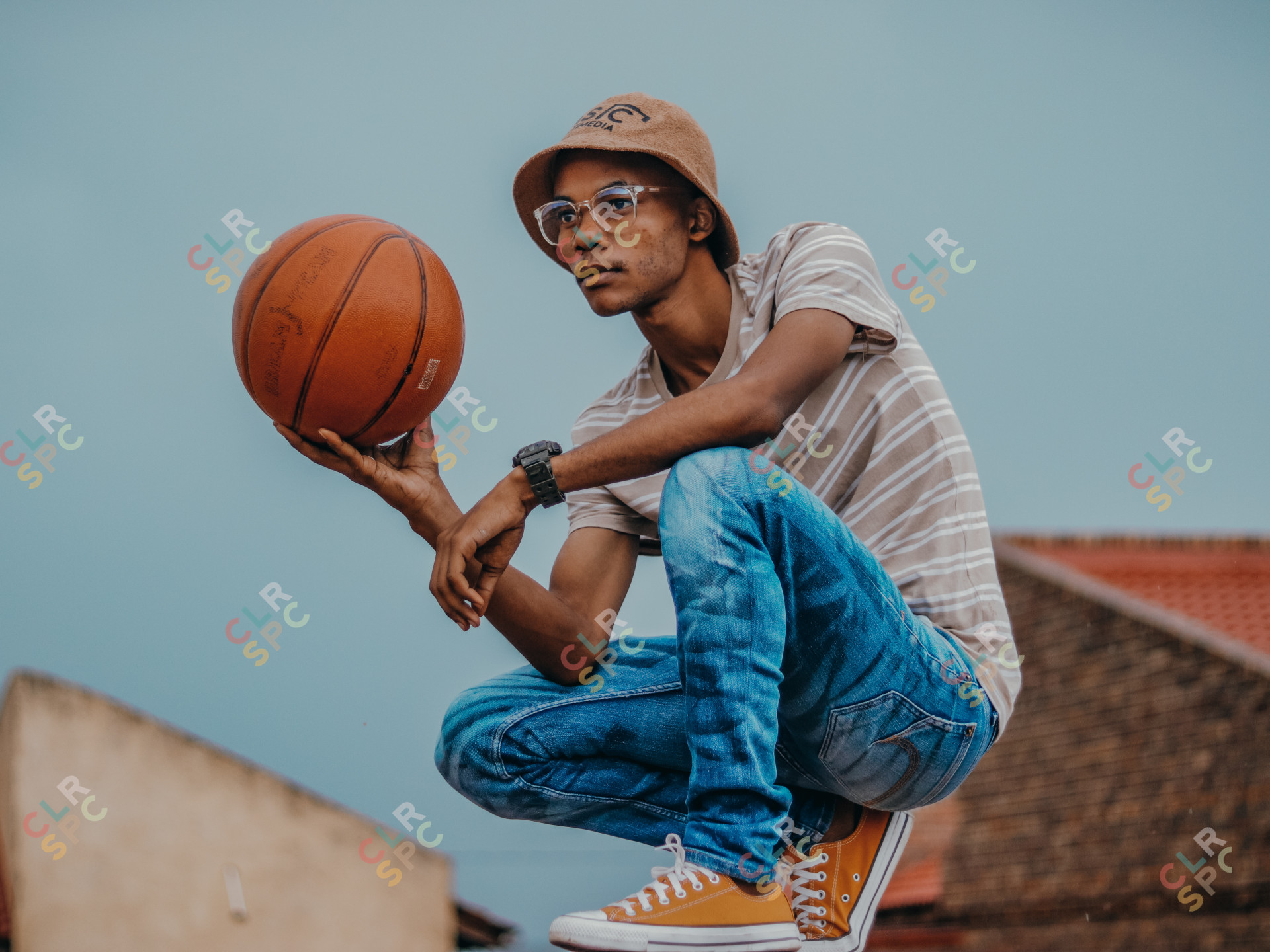 Black Man Holding A Basketball