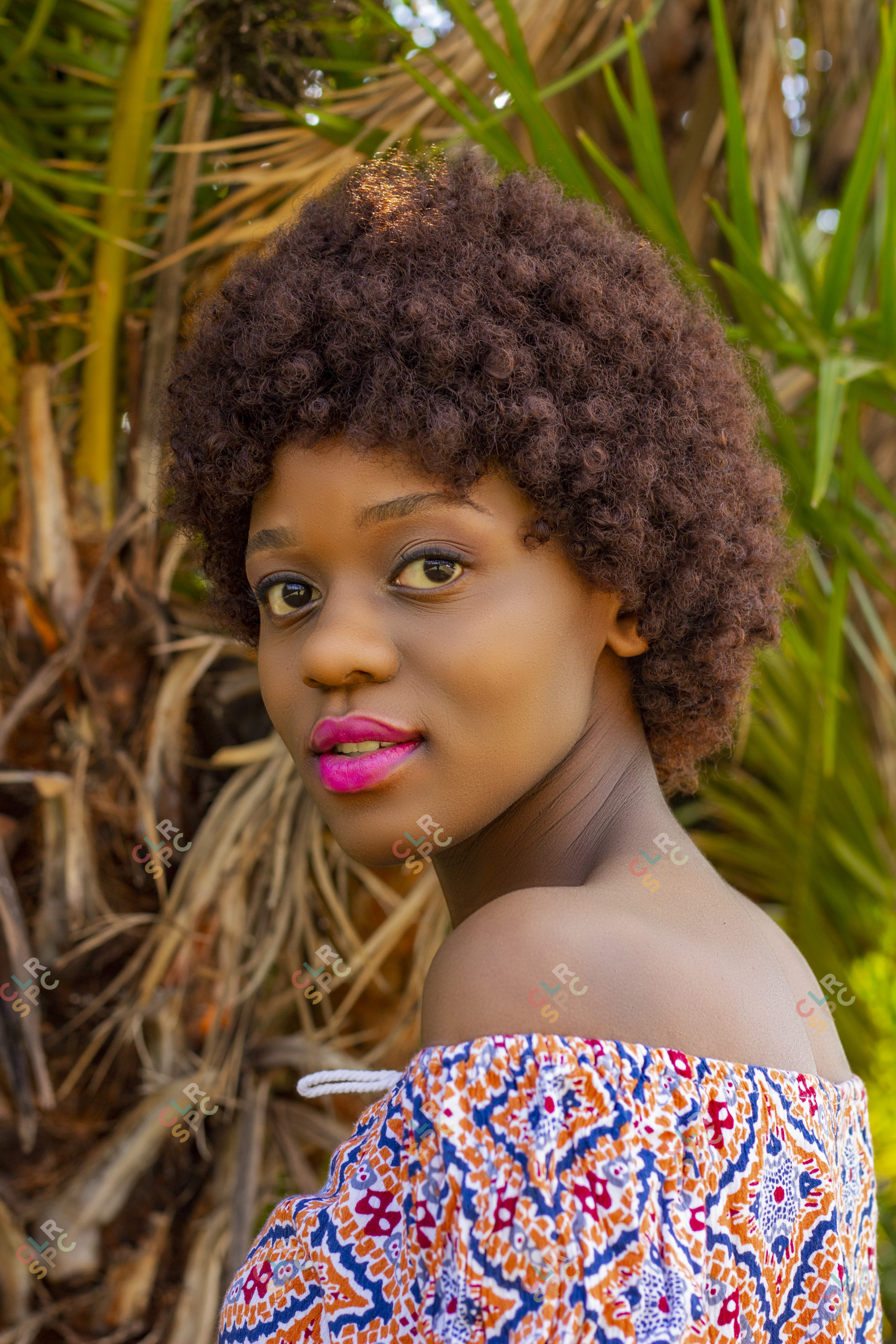 Young afro woman with brown hair