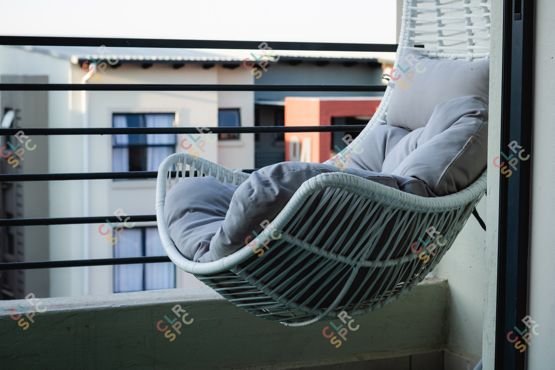 Hanging chair in a town house balcony